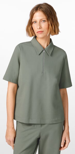 Women’s Polo Shirt Green, presented on a model