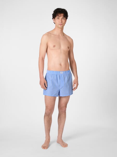Men's woven boxer shorts Light white, presented on a model