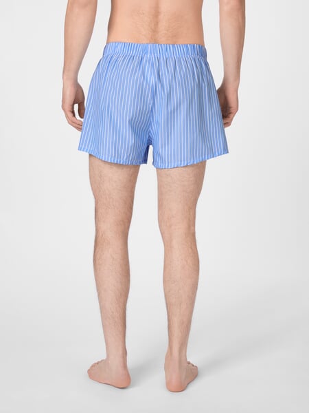 Men's woven boxer shorts Light white, presented on a model