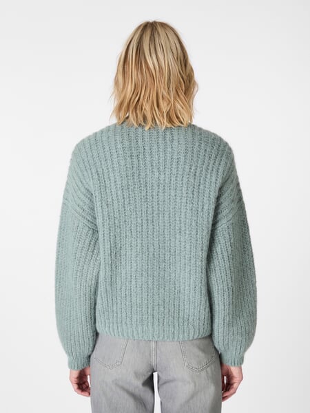 Ladies cardigan buttoned Petrol, presented on a model