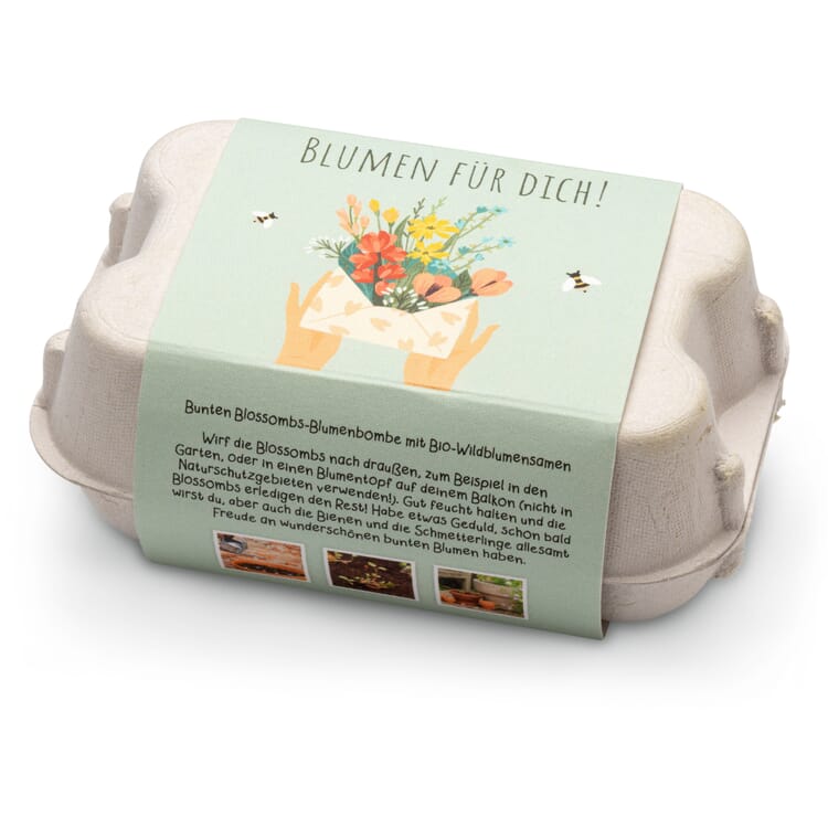 Boules de fleurs dans une boîte cadeau