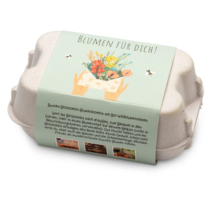 Boules de fleurs dans une boîte cadeau