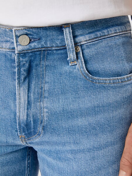Men’s Jean Shorts." Denim, close-up