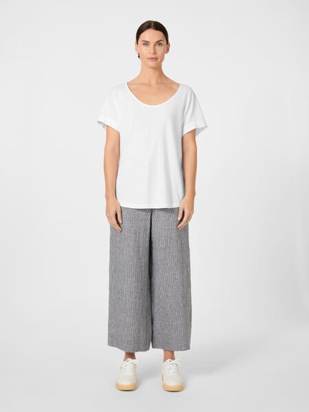 Women's Short-Sleeve Shirt White, presented on a model
