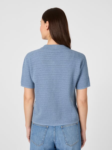 Women’s Knitted Button-Down Polo Shirt Light blue, presented on a model