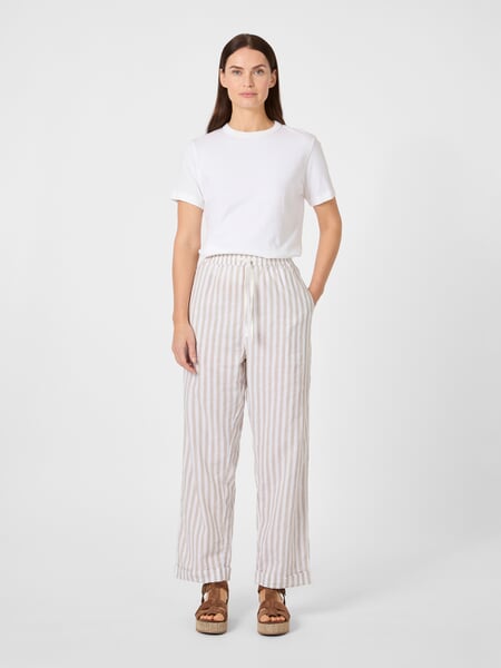 Women's striped fabric trousers Natural white, presented on a model