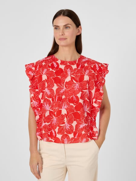 Women's Volant Blouse Shirt Red with a pattern, presented on a model