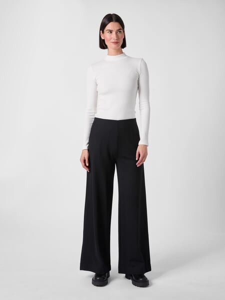Jerseybroek voor dames Zwart, gepresenteerd op een model