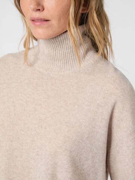 Damestrui van lamswol Beige, close-up