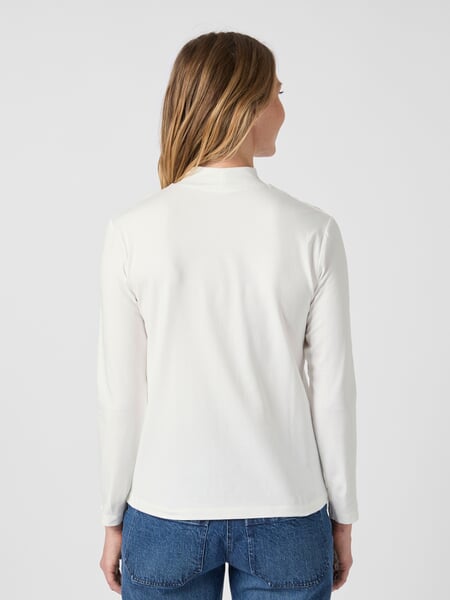 Women’s Long-Sleeve Shirt with Stand-Up Collar." Ecru", presented on a model