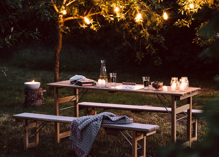 Garden table with candles and game