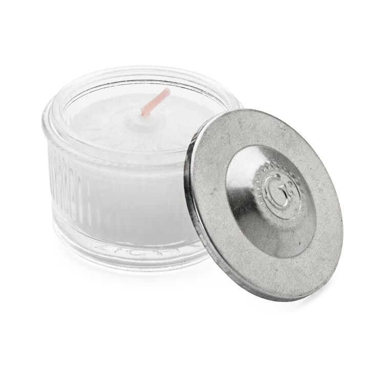 Fyrfadslys i en krukke med slukkelåg